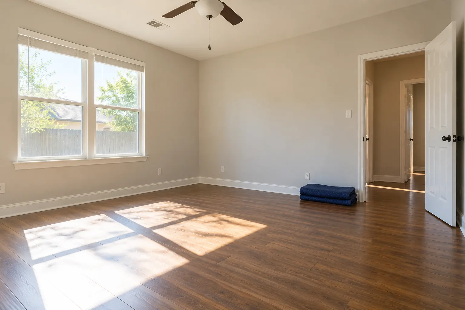 A bright cleared bedroom with clean floors